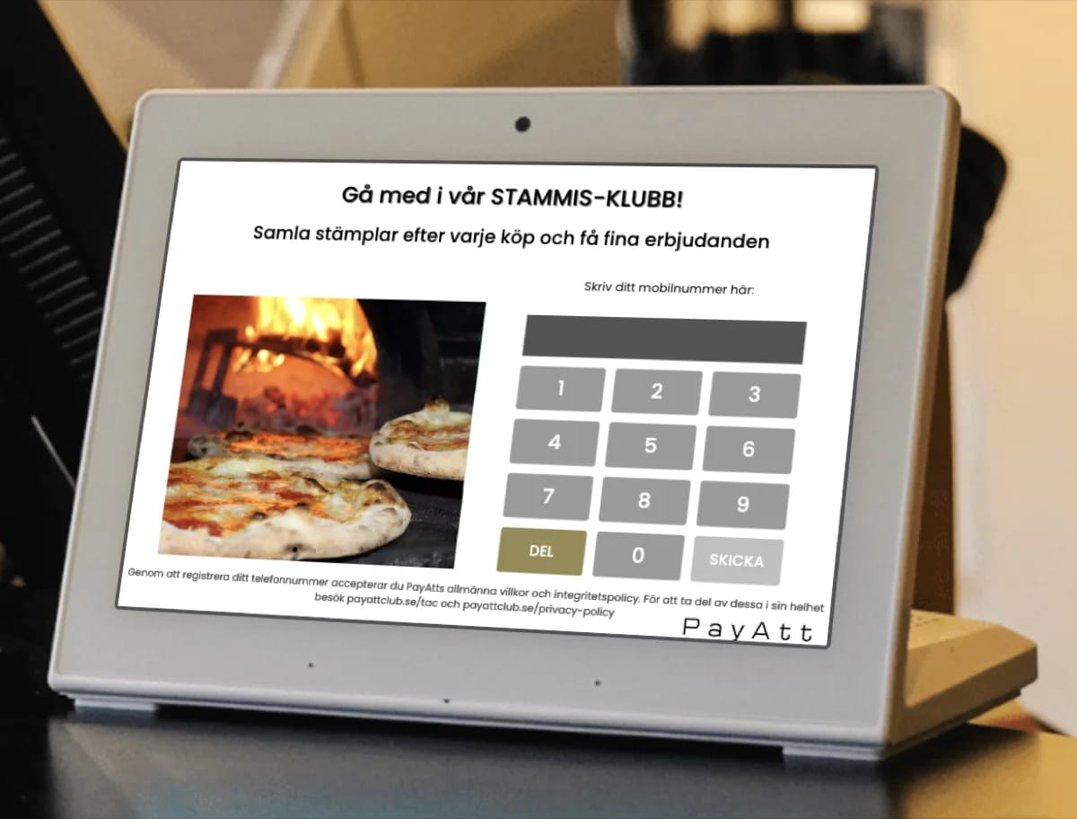 Registreringsskärm i en pizzeria — kunden fyller i sitt mobilnummer