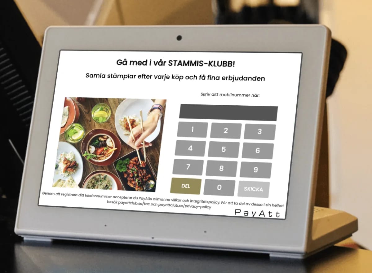 Registreringsskärm i en sushirestaurang — kunden fyller i sitt mobilnummer