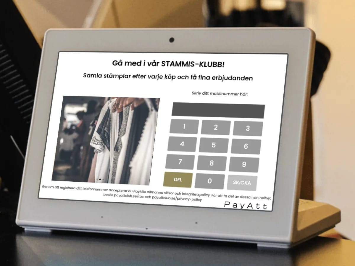 Registreringsskärm i en kläd- och inredningsbutik — kunden fyller i sitt mobilnummer